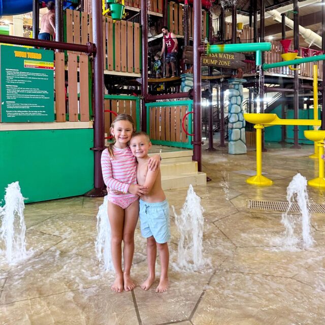 Surprising these two with this trip to @greatwolflodge has been everything we hoped so far! 🐾🤍 We have done water ride after water ride, rode the waves in the wave pool, made build-a-bears, ate our weight in nachos and pizza and walked up and down 30+ flights of stairs on the MagiQuest(thank goodness I packed us all tennis shoes this year 😜) #greatwolflodge truly is magical. It’s so much fun. #hosted #ad